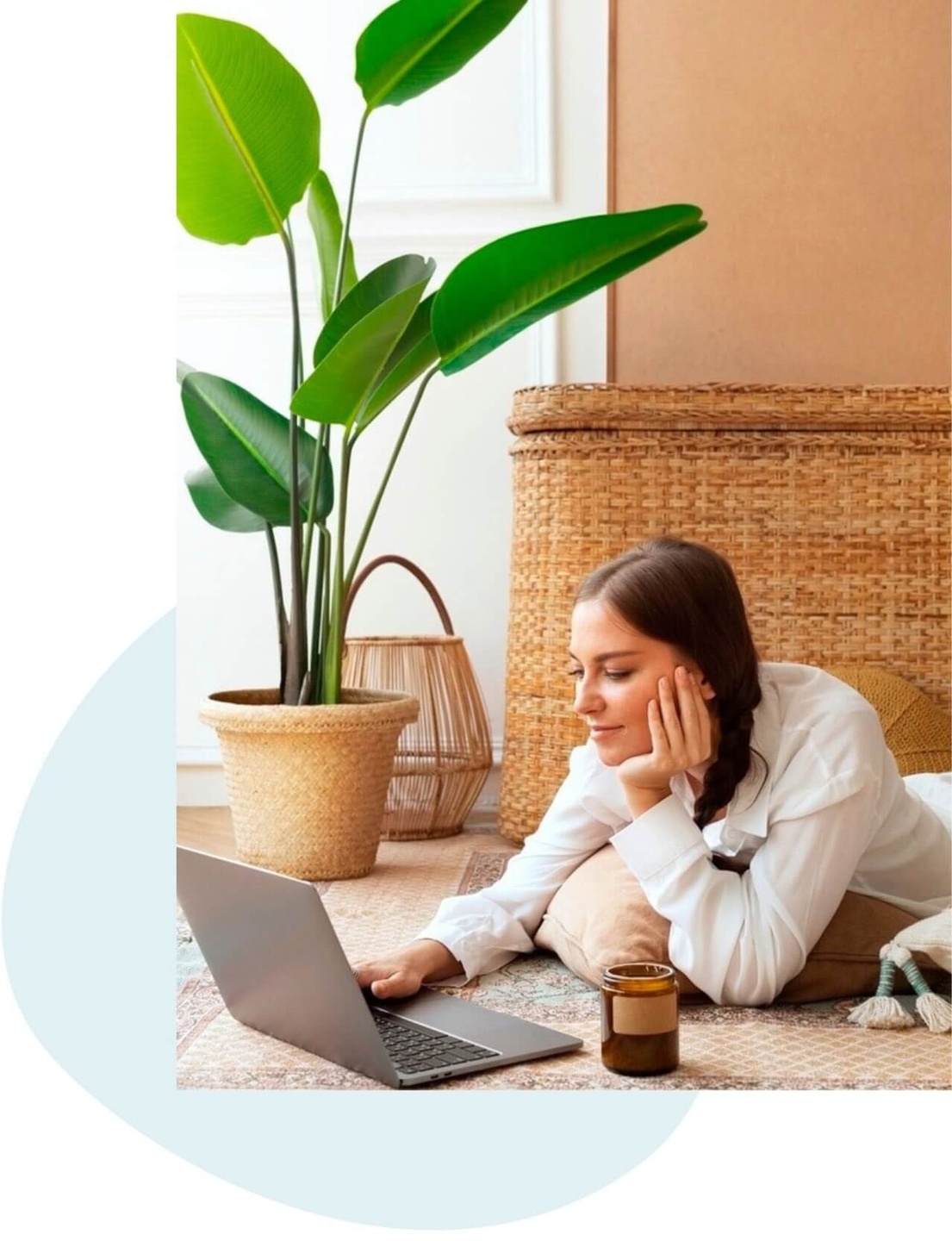 Curly haired brunette at cafe working on laptop